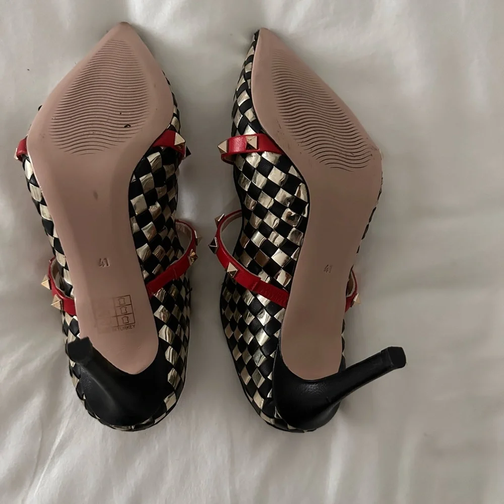 Elegant Black and Gold Checkered Heels with Red Accents